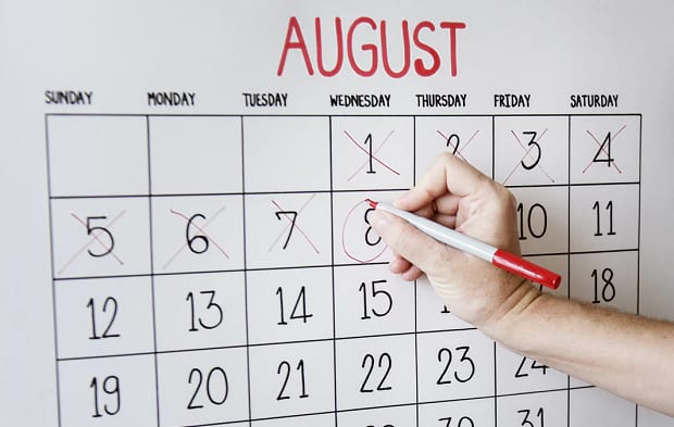 An August calendar with several days marked off and the 8th being circled with a marker